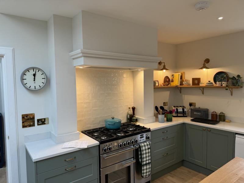 Kitchen with range cooker and wall lights